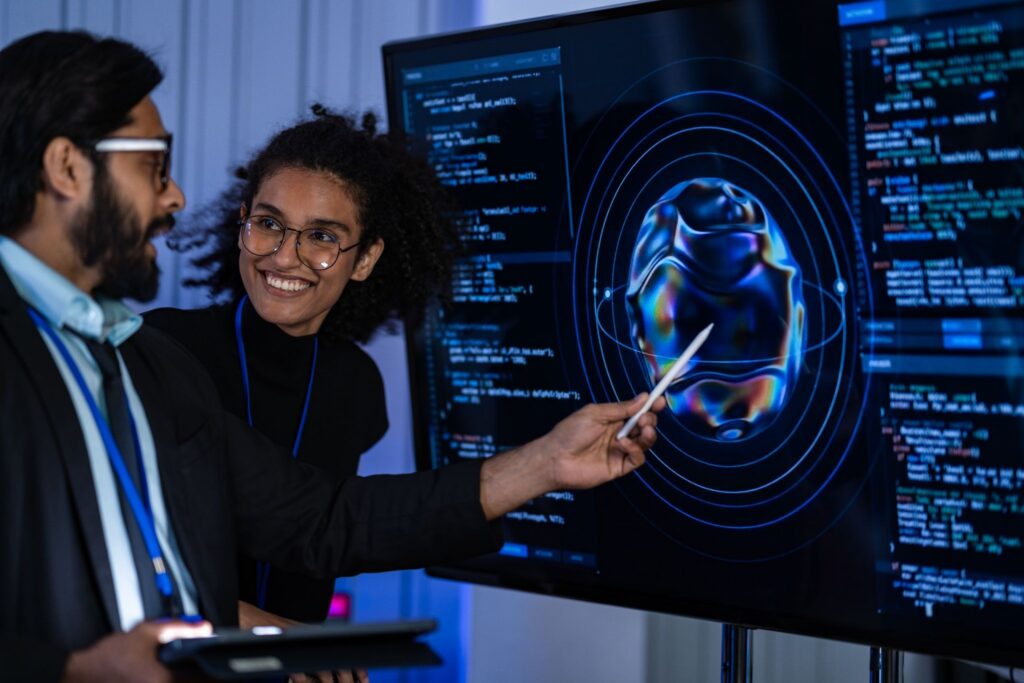 woman showing IT example on screen