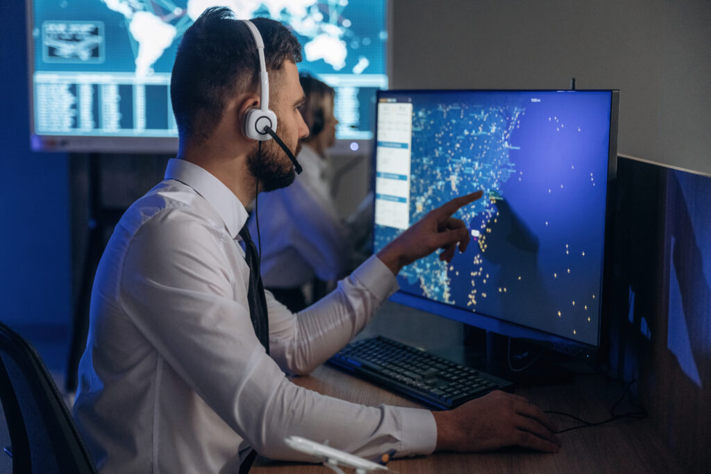 man controls air traffic using information technology