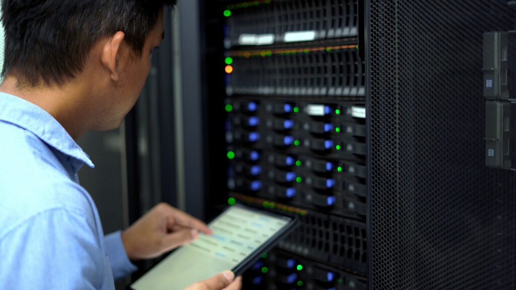 IT technician inspecting legacy server